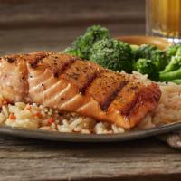 Mesquite Wood-Grilled Salmon · Served with garlic dill sauce and two signature sides.