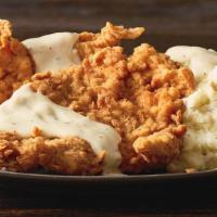 Country Style Buttermilk Chicken · Chicken breasts hand-dipped and breaded, topped with white pepper gravy and served with two ...