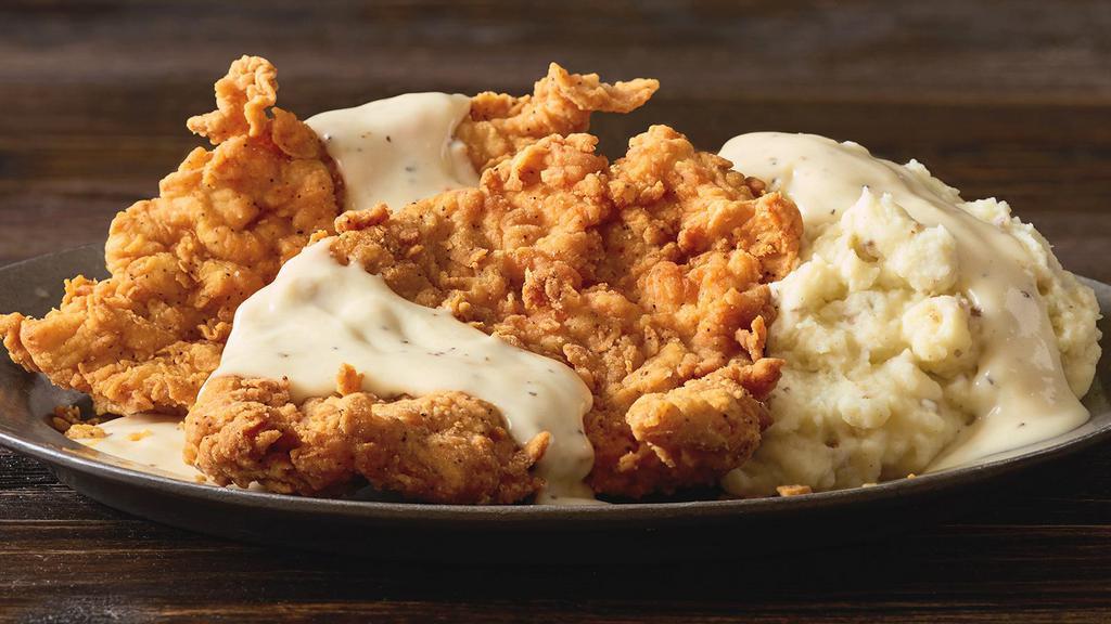 Country Style Buttermilk Chicken · Chicken breasts hand-dipped and breaded, topped with white pepper gravy and served with two signature sides. * 
 
*Logan's signature item