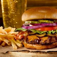Original Roadhouse Burger · Served with thick-cut hardwood smoked bacon, signature roadhouse BBQ sauce, shredded jack an...