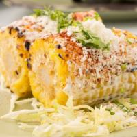 Grilled Corn On The Cob · Mayonnaise, lime, chili powder, cotija cheese.