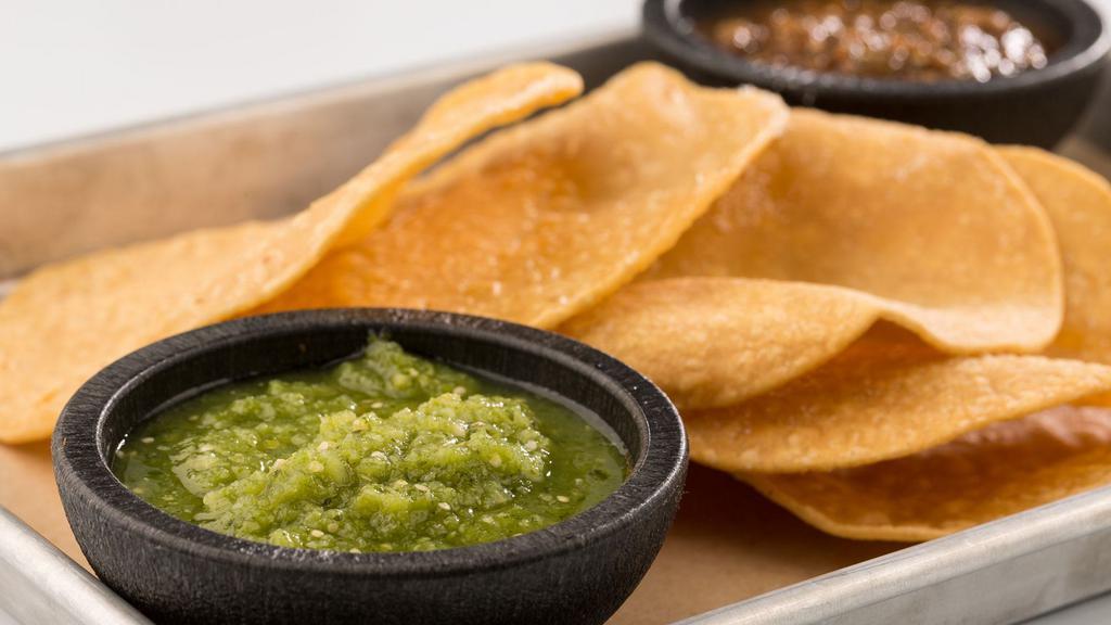 Chips & Salsa · Red (spicy roasted tomato) and green (mild tomatillo) salsas.