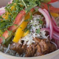 Braised Short Rib · Slow-braised ancho short ribs, cotija cheese, pickled onions, cilantro, brown rice, peppers,...