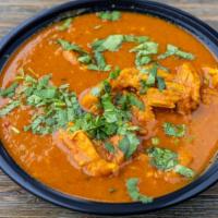 Chicken Curry · Tender chicken in mild sauce.