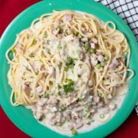 Spaghetti Carbonara · Bacon, ham, green peas, green onions in a creamy sauce.