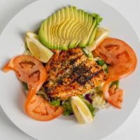 Salmon Salad · Fresh mixed greens, broiled salmon, avocado, tomato, lemon wedges and dressing.
