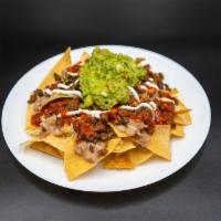 Los Nachos · Chips, Beans, Meat, cheese, Sour cream, Guacamole and Salsa