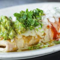 El Don · Our signature burrito stuffed with rice, beans, tomatoes and lettuce. Topped with melted che...