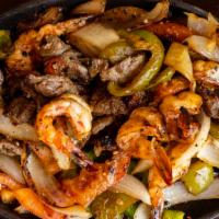 Las Fajitas (2) · Your choice of 2 meats grilled with onion, tomato, and bell peppers. Served with rice and ei...