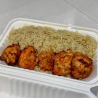 Chicken Kebab Box · Brochettes of marinated chicken breast skewer served over rice pilaf.