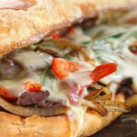 Philly Cheesesteak · Marinated streak, red onions, bell peppers  topped with mozzarella cheese served on a butter...