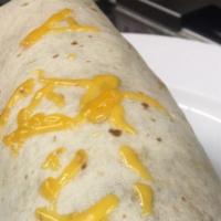Breakfast Burrito · Eggs, potatoes, cheese, bacon, or sausage all wrapped in a flour tortilla.