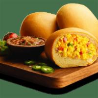Ranchero · The #1 seller in our egg offerings.  Scrambled eggs mixed with ground ham, picante sauce, ch...