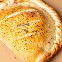 Calzone · Handmade, up to six toppings with cheese and a side of marinara, exquisite!.