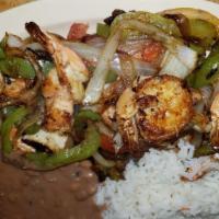 Fajitas De Camaron · Shrimp grilled  fajitas.with green pepper onion and tomatoes this item does not include salad