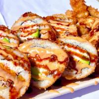 Double Crunch Roll · Inside: Two Shrimp Tempura, Avocado, Imitation Crab. 
Outside:  Eel Sauce, Spicy Mayo