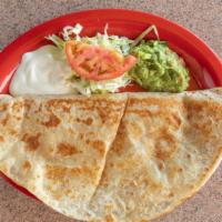 Quesadilla · Melted cheese and tomato salsa in a flour tortilla, served with sour cream and guacamole.