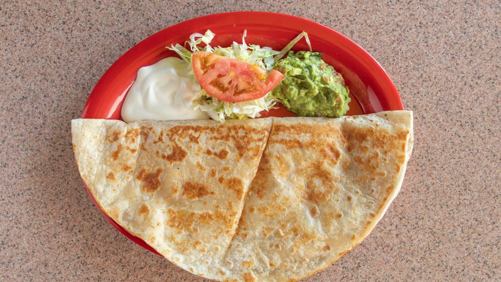 Quesadilla · Melted cheese and tomato salsa in a flour tortilla, served with sour cream and guacamole.