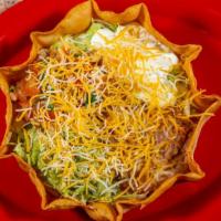 Taco Salad · Ground Beef, Shredded Chicken or Steak with beans, lettuce, chips, cheese, sour cream and to...