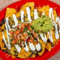 Súper Nachos · Chips, black beans, cheese, sour cream, guacamole and tomato salsa pick your meat ... chicke...