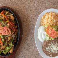 Fajitas · Grilled red and green pepper, onions and meat, served with beans, rice, sour cream and torti...