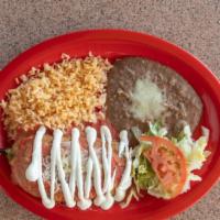 Chille Relleno Plate · Chile Relleno, beans, rice, lettuce and tomato.