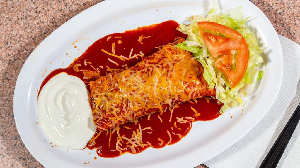 One Enchilada · Corn tortilla covered with enchilada sauce and melted cheese.
