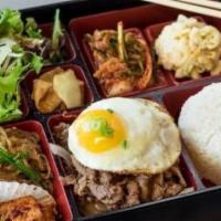 Bento Box Beef Bulgogi · Beef Bulgogi served with Rice, Salad, Miso Soup, and a variety of seasonal side dishes.