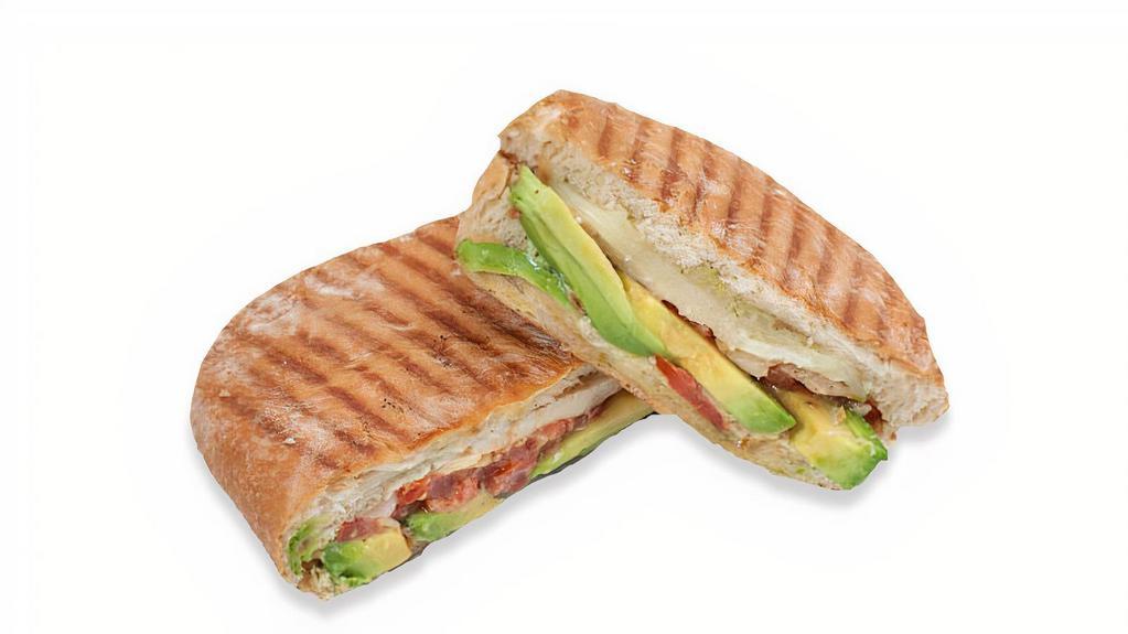 Grilled Panini · Your choice of chicken, turkey or white albacore tuna topped with provolone, fresh basil, tomato, avocado, pesto mayo. Served on a French baguette.