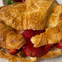 Nutella Croissant · Buttery croissant filled with Nutella. 
Add strawberries and/or bananas (+1)