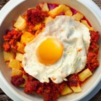 Huevos Chorizo · Farm fresh eggs scrambled with flavorful chorizo and served with avocado, rice, beans, and t...