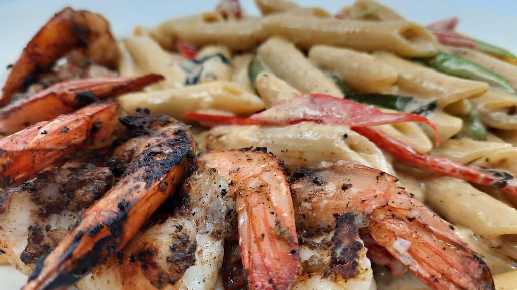 Jerk Shrimp  · Served with your choice of rasta pasta, rice and peas, mixed vegetables, and mashed potatoes or white rice.
