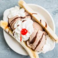 Banana Split · 3 scoops of ice cream in between a banana and topped with whipped cream and sprinkles
