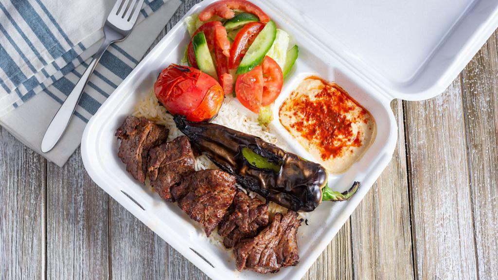 Beef Shish Kabob · Served with rice, green salad, hummus and grilled tomato/pepper