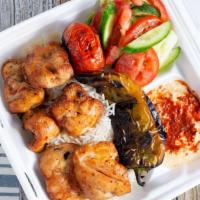 Chicken Thigh · Served with rice, green salad, hummus and grilled tomato/pepper