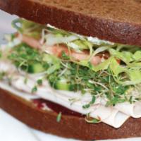 Turkey Healthy Sandwich · Turkey, cream cheese, cranberry sauce, cucumber, sprouts tomatoes, lettuce and mayo on squaw...
