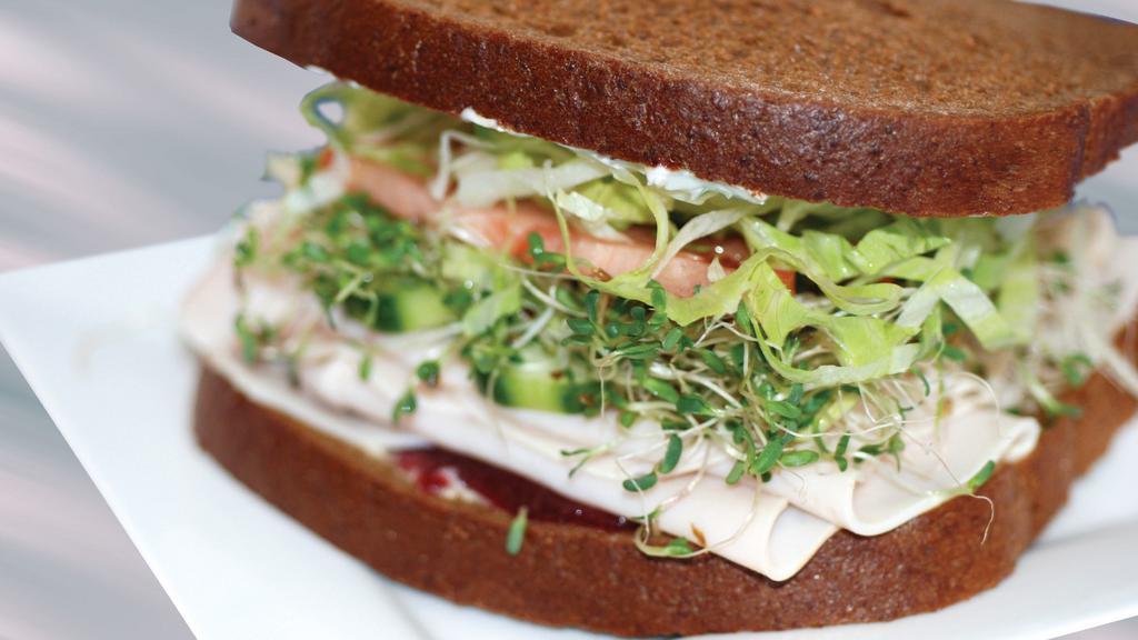 Turkey Healthy Sandwich · Turkey, cream cheese, cranberry sauce, cucumber, sprouts tomatoes, lettuce and mayo on squaw bread.
Serve with potato salad