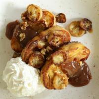 Bananas Foster French Toast · made-to-order, topped with walnuts, caramelized bananas, our caramel sauce and whipped cream...