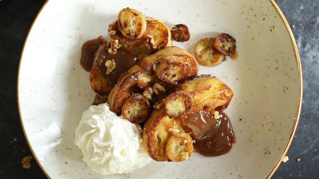 Bananas Foster French Toast · made-to-order, topped with walnuts, caramelized bananas, our caramel sauce and whipped cream [940 cal]