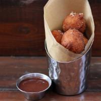 Donut Holes · made to order, tossed in cinnamon + sugar, served with nutella dip [530 cal]