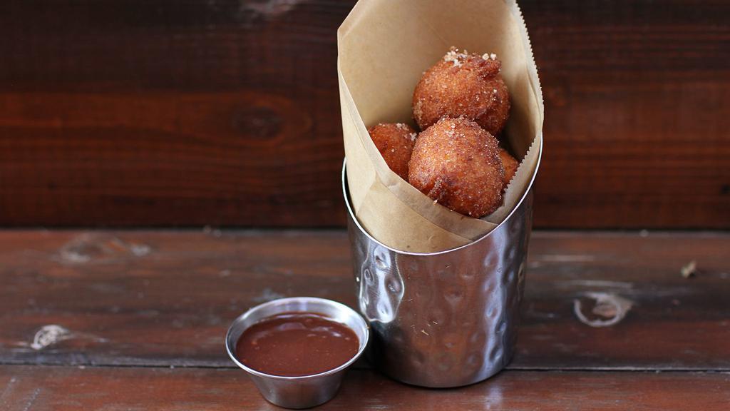 Donut Holes · made to order, tossed in cinnamon + sugar, served with nutella dip [530 cal]