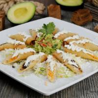 Taquito Sampler · 3 shredded beef & 3 chicken, with guacamole & sour cream & cheese.