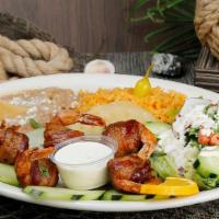 Camarones Costa Azul Plate · Shrimp wrapped in bacon served with rice, beans and salad.