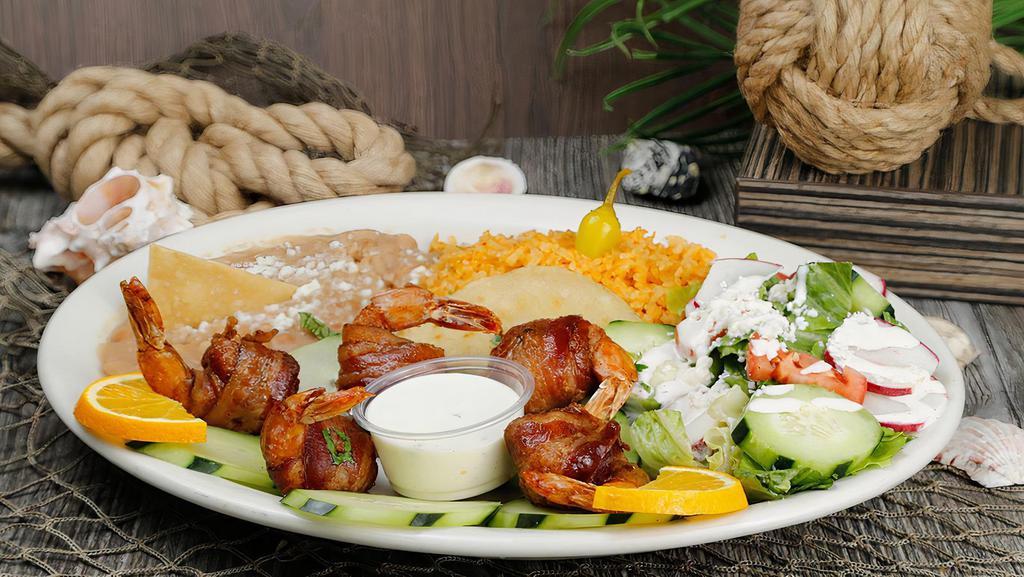Camarones Costa Azul Plate · Shrimp wrapped in bacon served with rice, beans and salad.
