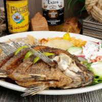Mojarra Frita · Deep fried whole fish Tilapia served with rice, beans and salad.