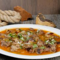 Birria Soup · Birria served in its broth in a bowl, along with home made tortillas.