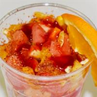 Happy Fruit Cup  · Chopped Fruit, Orange Juice, Tajin, Lime and Chamoy.