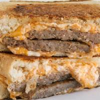 Sausage Grilled Cheese Breakfast Sandwich · The grilled cheese breakfast sandwich loaded with american and swiss cheese, folded egg, and...