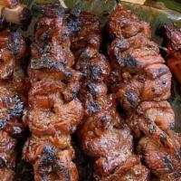 Hawaiian Style Pork Bbq · Sweet-chili, soy sauce-marinated pork on skewers.