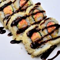 Crunchy Roll · Crab, shrimp, tempura, avocado, cucumber topped with tempura flakes and eel sauce.
